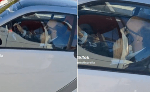 Al volante senza cintura e al telefono, bufera social su Roberto Benigni